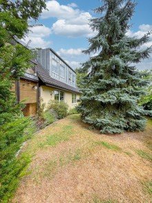 Gartenansicht Modern & nachhaltig wohnen: Tolles Einfamilienhaus mit Wintergarten und PV-Anlage in Woltersdorf!
